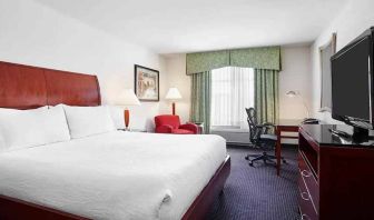 spacious king room with work area and lounge at Hilton Garden Inn Rockville-Gaithersburg.