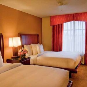 luxurious queen room with TV at Homewood Suites by Hilton Rockville-Gaithersburg.