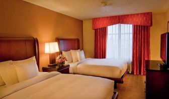 luxurious queen room with TV at Homewood Suites by Hilton Rockville-Gaithersburg.