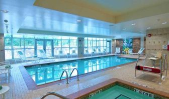 beautiful indoor pool with seating at Homewood Suites by Hilton Rockville-Gaithersburg.