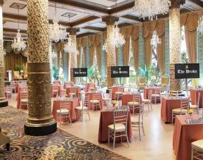 Elegant event room with big windows, chairs and tables at the Drake.