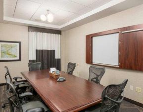 Small meeting room with screen at the Hilton Garden Inn Silver Spring White Oak.