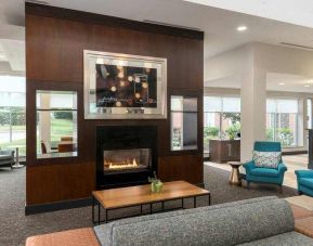 Beautiful workspace by the fireplace in a hotel lobby at the Hilton Garden Inn Silver Spring White Oak.