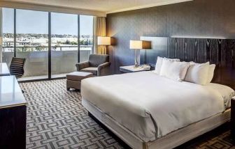Comfortable king suite with city view at the Hilton Sacramento-Arden West.