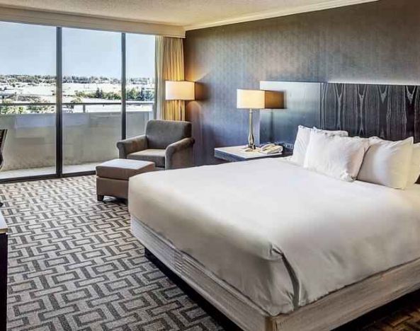 Comfortable king suite with city view at the Hilton Sacramento-Arden West.
