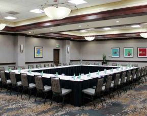 Meeting room with square conference table at the Hilton Sacramento-Arden West.