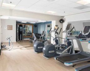 Fully equipped fitness center at the DoubleTree by Hilton Charlotte-Gateway Village.