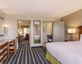 Spacious king suite with desk at the Embassy Suites by Hilton San Francisco Airport Waterfront.