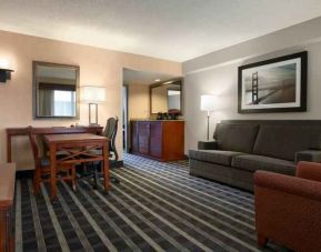 Comfortable living room in a hotel suite at the Embassy Suites by Hilton San Francisco Airport Waterfront.
