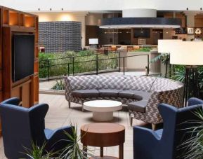 Elegant workspace in a hotel lobby at the Embassy Suites by Hilton San Francisco Airport.