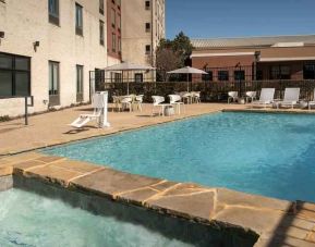 Relaxing outdoor pool area at the Hilton Garden Inn Dallas/Duncanville.