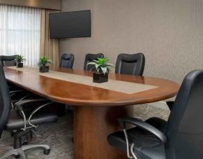 Meeting room with window and TV screen at the Hilton Garden Inn Dallas/Duncanville.