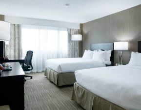 Spacious queen size room with 2 queen beds, desk, and chair at the Hilton Nashville Airport.
