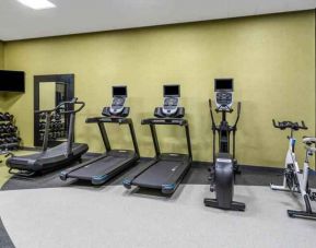 Fitness center with treadmills and weights at the Hilton Garden Inn Hays.