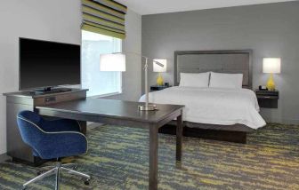 Working station in a king bedroom at the Hampton Inn & Suites by Hilton-Irvine/Orange County Airport.