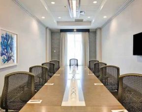 Small meeting room with window at the Embassy Suites by Hilton Miami - International Airport.