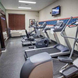 Well-equipped fitness center at Hampton Inn San Francisco Airport.