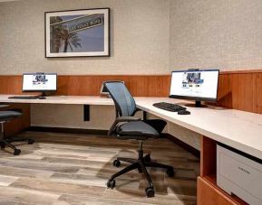 dedicated business center with PC, internet, printer, and work desk at Home2 Suites by Hilton Las Vegas Convention Center.