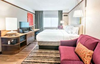 Bright and comfortable king guestroom at the Hilton Garden Inn Minneapolis Airport Mall of America.