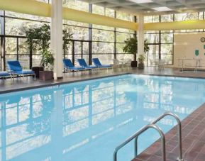 Relaxing indoor pool with lounges at the DoubleTree by Hilton Kansas City - Overland Park.