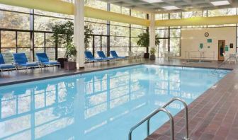 Relaxing indoor pool with lounges at the DoubleTree by Hilton Kansas City - Overland Park.