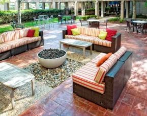 Beautiful outdoor patio with garden perfect as workspace at the DoubleTree by Hilton Kansas City - Overland Park.