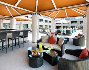 beautiful outdoor lounge and coworking space by the pool at Hilton Houston Post Oak by the Galleria.