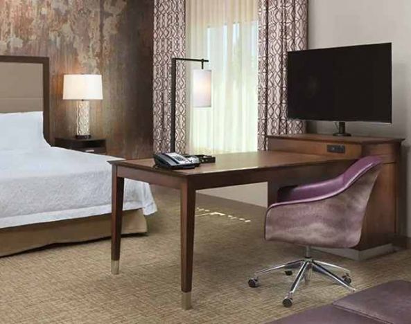 Spacious king suite with work area at Hampton Inn & Suites Murrieta Temecula.