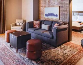 Stylish living room in a king suite at the Estancia del Norte San Antonio, Tapestry Collection.