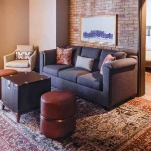 Stylish living room in a king suite at the Estancia del Norte San Antonio, Tapestry Collection.
