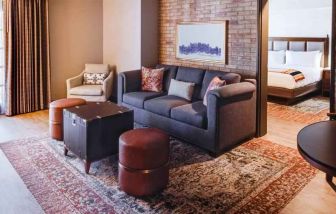 Stylish living room in a king suite at the Estancia del Norte San Antonio, Tapestry Collection.