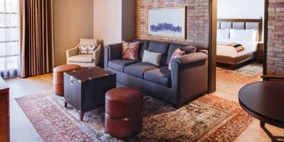 Stylish living room in a king suite at the Estancia del Norte San Antonio, Tapestry Collection.