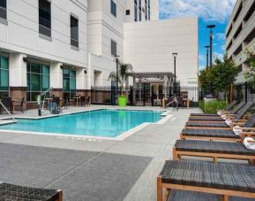 Outdoor pool area with lounges at the Hilton Garden Inn Houston Medical Center, TX.