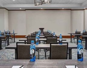 Large meeting room with tables and chairs at the Hilton Garden Inn Houston Medical Center, TX.