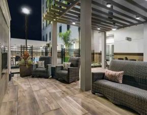 Outdoor patio with lounges perfect as workspace at the Hilton Garden Inn Houston Medical Center, TX.