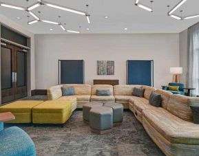 Stylish workspace with lounges at the Home2 Suites by Hilton Houston Medical Center.