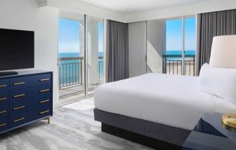 gorgeous king bedroom with sea views at Embassy Suites by Hilton Myrtle Beach Oceanfront Resort.