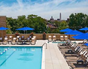 gorgeous outdoor pool with seating and sun beds at Washington Hilton.