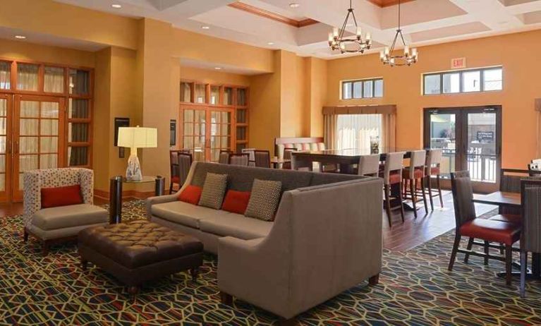 Comfortable lobby lounge area ideal for coworking at Hampton Inn & Suites Pueblo-Southgate.