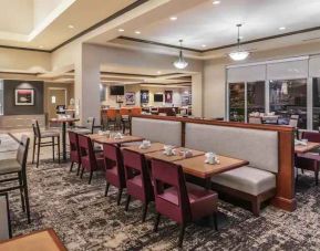 Comfortable breakfast seating with tables and lounges at the Hilton Garden Inn Blacksburg University.