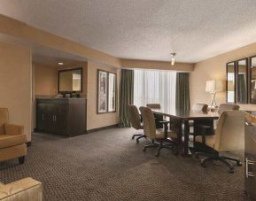 Living room with working station at the Embassy Suites by Hilton Birmingham.