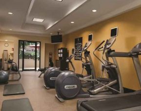 Fitness center with treadmills and mirrors at the Embassy Suites by Hilton Birmingham.
