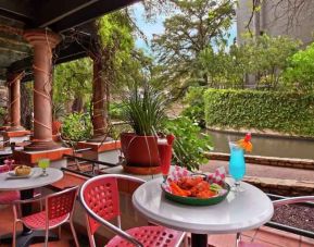 Outdoor workspace by the river at the Hilton Palacio del Rio.