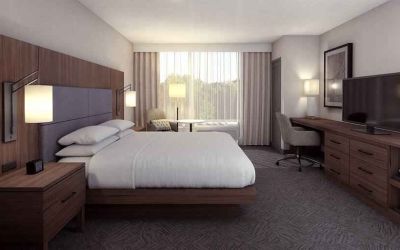 Spacious king bedroom with king size bed and sofa at the DoubleTree by Hilton Lafayette East.
