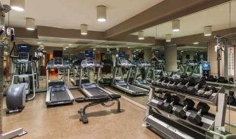 Well-equipped fitness center at The Sam Houston, Curio Collection by Hilton.
