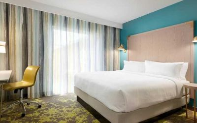 spacious king room with work desk ideal for working remotely at Embassy Suites by Hilton Boulder.