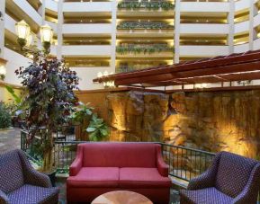 Comfortable workspace in a hotel lobby at the Embassy Suites by Hilton Charleston Airport Convention Center.