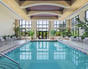Bright hotel area with indoor pool at the Embassy Suites by Hilton Hot Springs Hotel & Spa.
