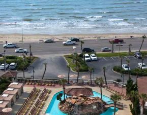Outdoor pool area in front of the beach at the Hilton Galveston Island Resort.