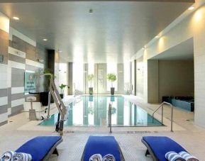 Relaxing indoor pool with lounges at the Hilton Columbus Downtown.